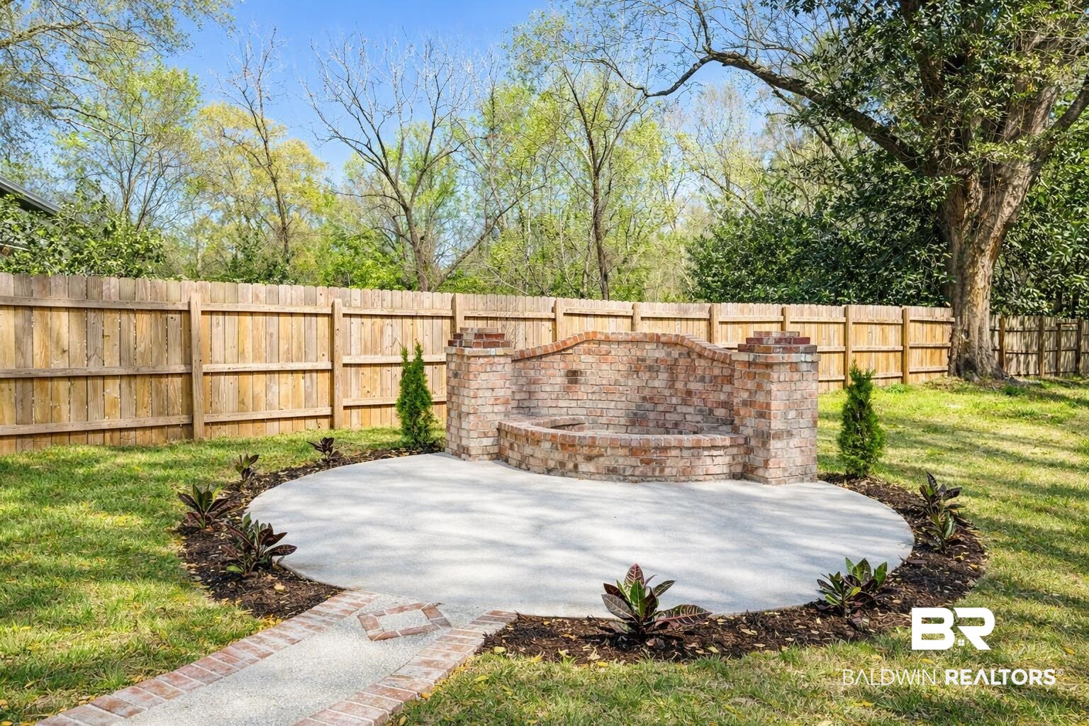 613 Forrest Avenue Brewton, AL 36426 - Photo 3 of 22 Fenced backyard featuring a patio area