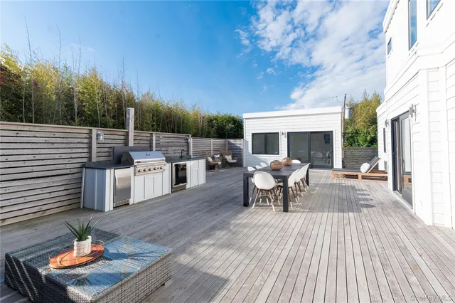 a sitting area with furniture and wooden floor