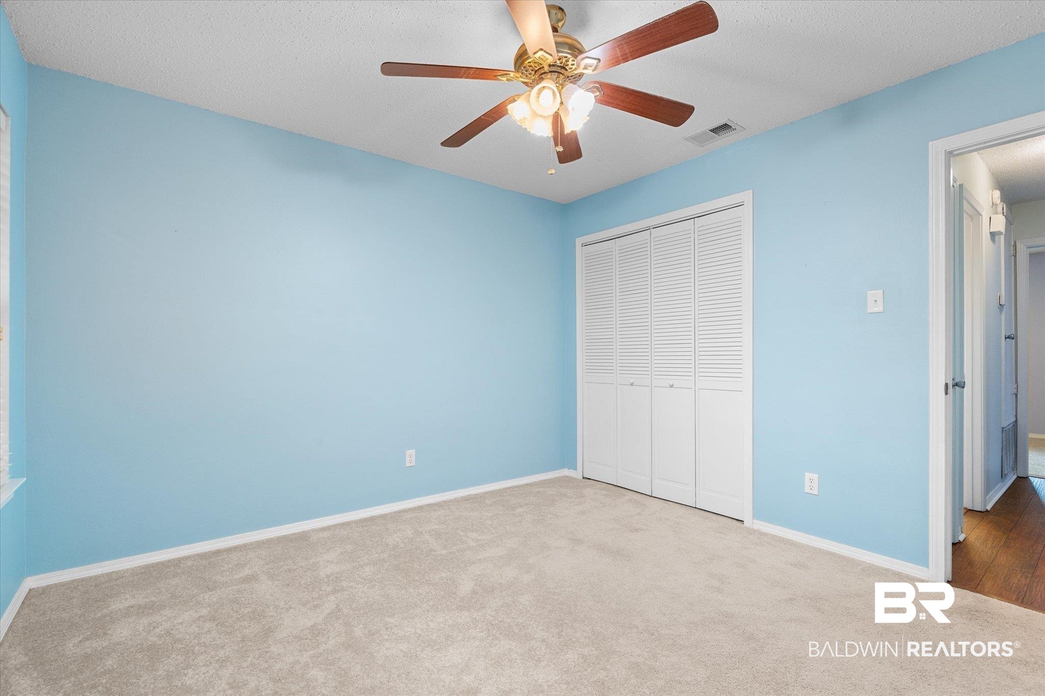 5645 Green Tree Road Mobile, AL 36609 - Photo 17 of 30 Unfurnished bedroom featuring carpet, a closet, baseboards, and ceiling fan