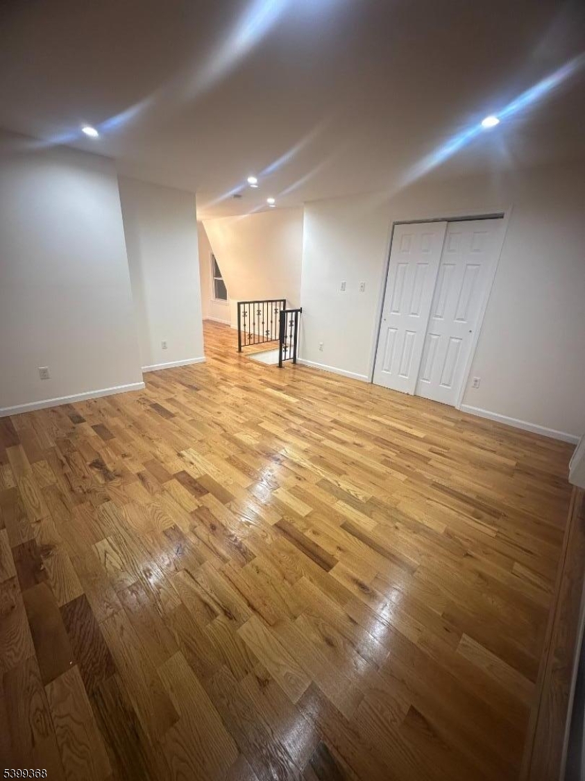 192 Fairview Avenue, Unit 3 Jersey City, NJ 07304 - Photo 3 of 9 a view of empty room with wooden floor