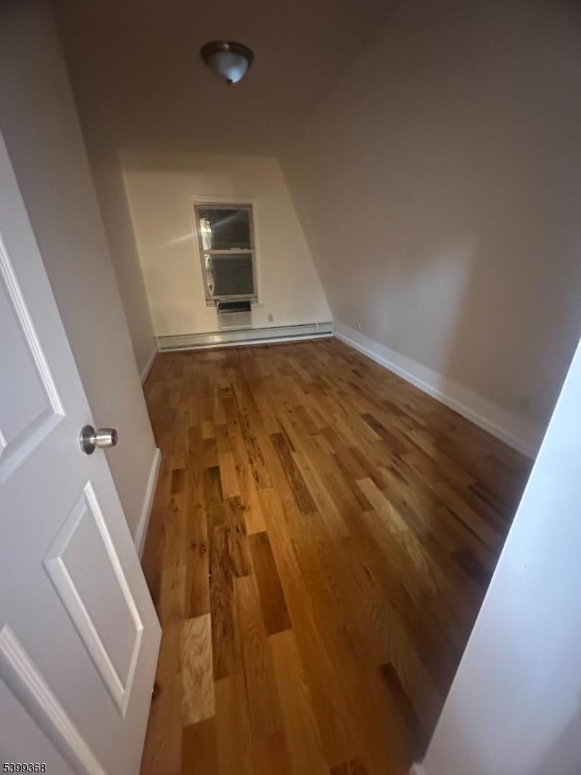 192 Fairview Avenue, Unit 3 Jersey City, NJ 07304 - Photo 5 of 9 a view of wooden floor in an empty room