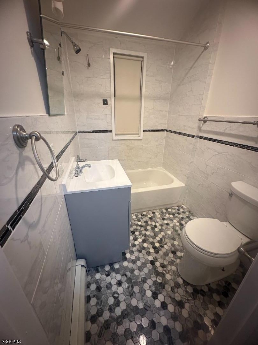 192 Fairview Avenue, Unit 3 Jersey City, NJ 07304 - Photo 6 of 9 a bathroom with a sink toilet and shower