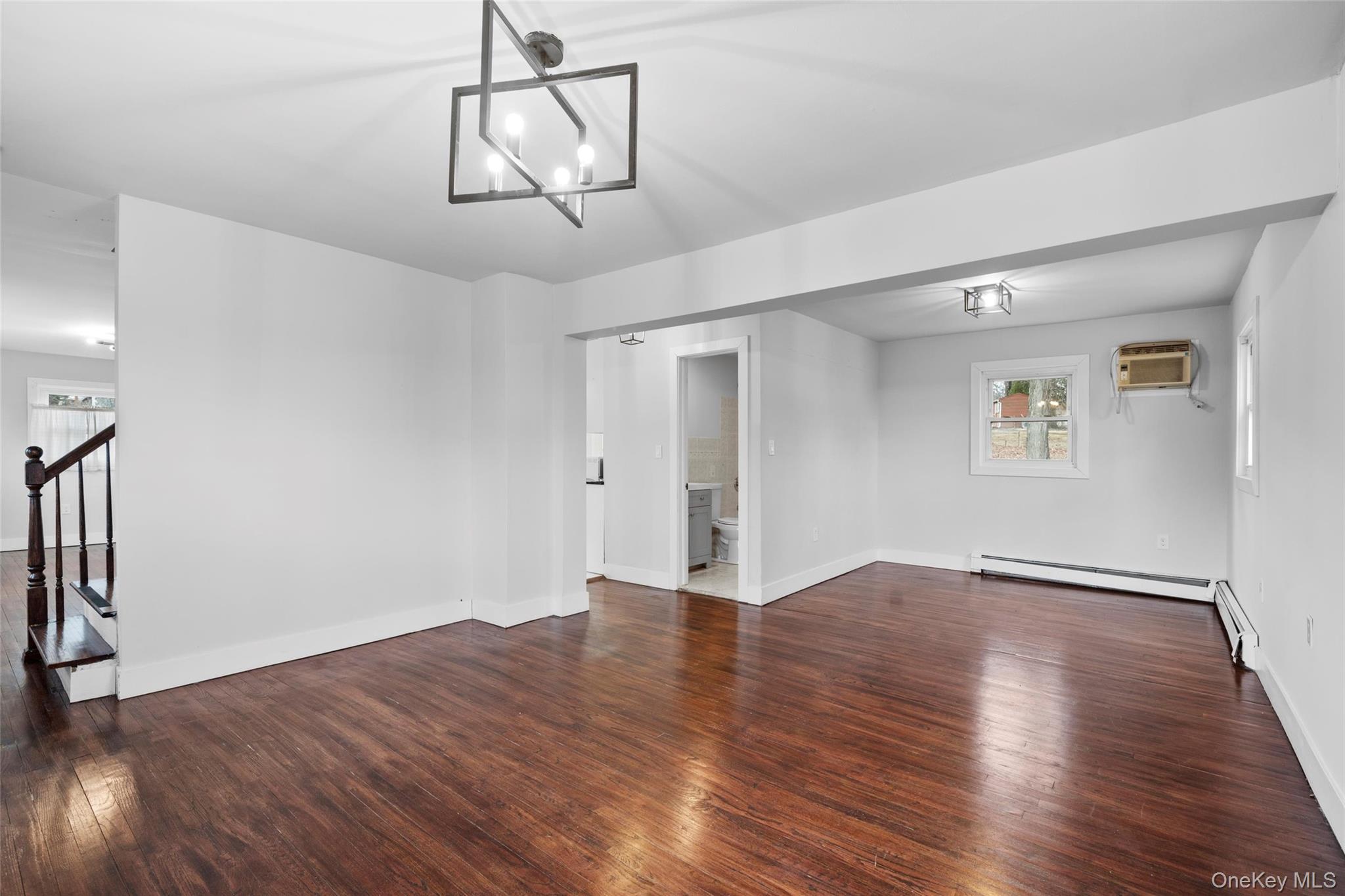 57 School Road Monroe, NY 10950 - Photo 14 of 33 a view of an empty room with wooden floor and window