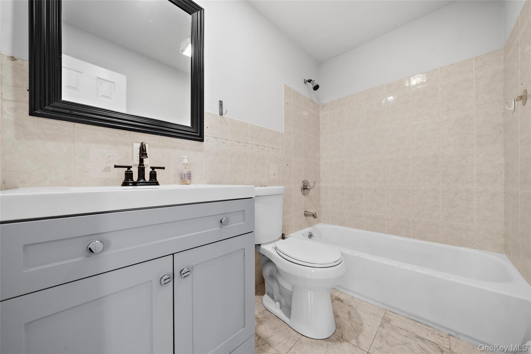 57 School Road Monroe, NY 10950 - Photo 18 of 33 a bathroom with a sink toilet and shower