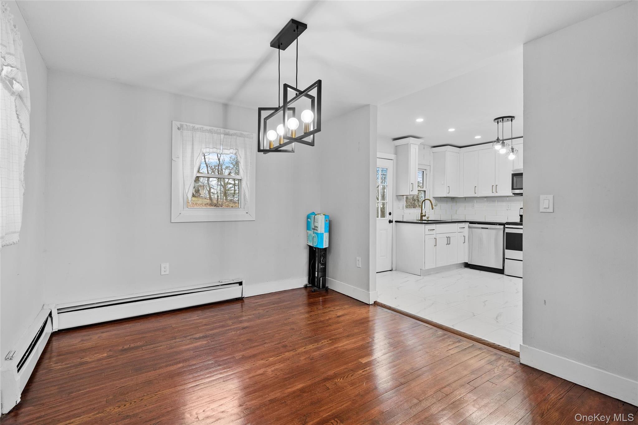 57 School Road Monroe, NY 10950 - Photo 20 of 33 a view of a kitchen with wooden floor and stainless steel appliances