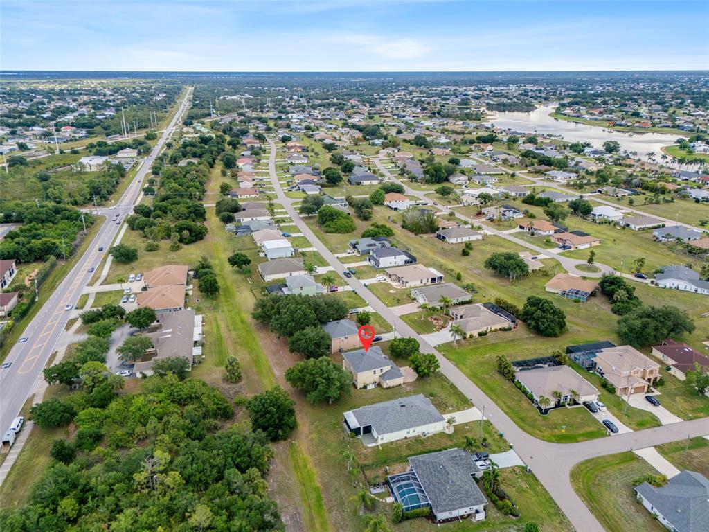 25134 Palisade Road Punta Gorda, FL 33983 - Photo 55 of 58 an aerial view of residential houses with outdoor space