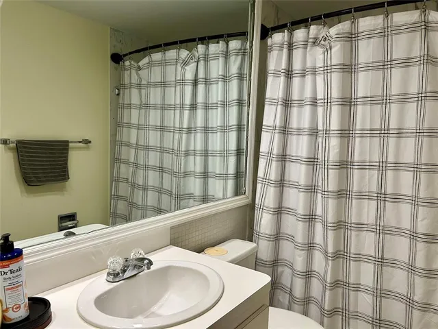 a bathroom with a sink and a shower