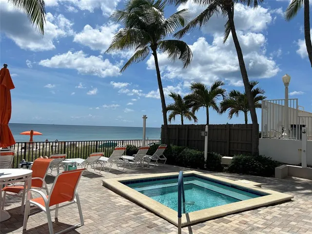 a dining room with a wooden table and chairs