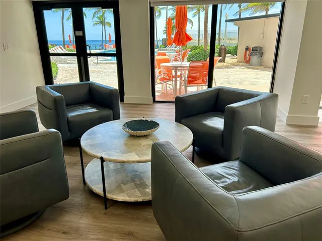 a kitchen with stainless steel appliances granite countertop a stove and white cabinets