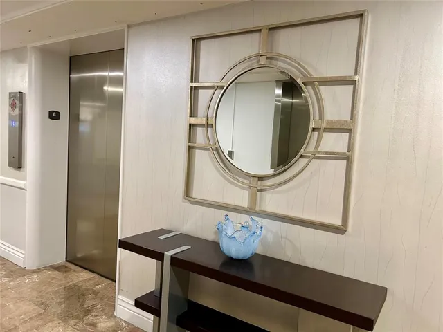 a bathroom with a sink a mirror and a toilet