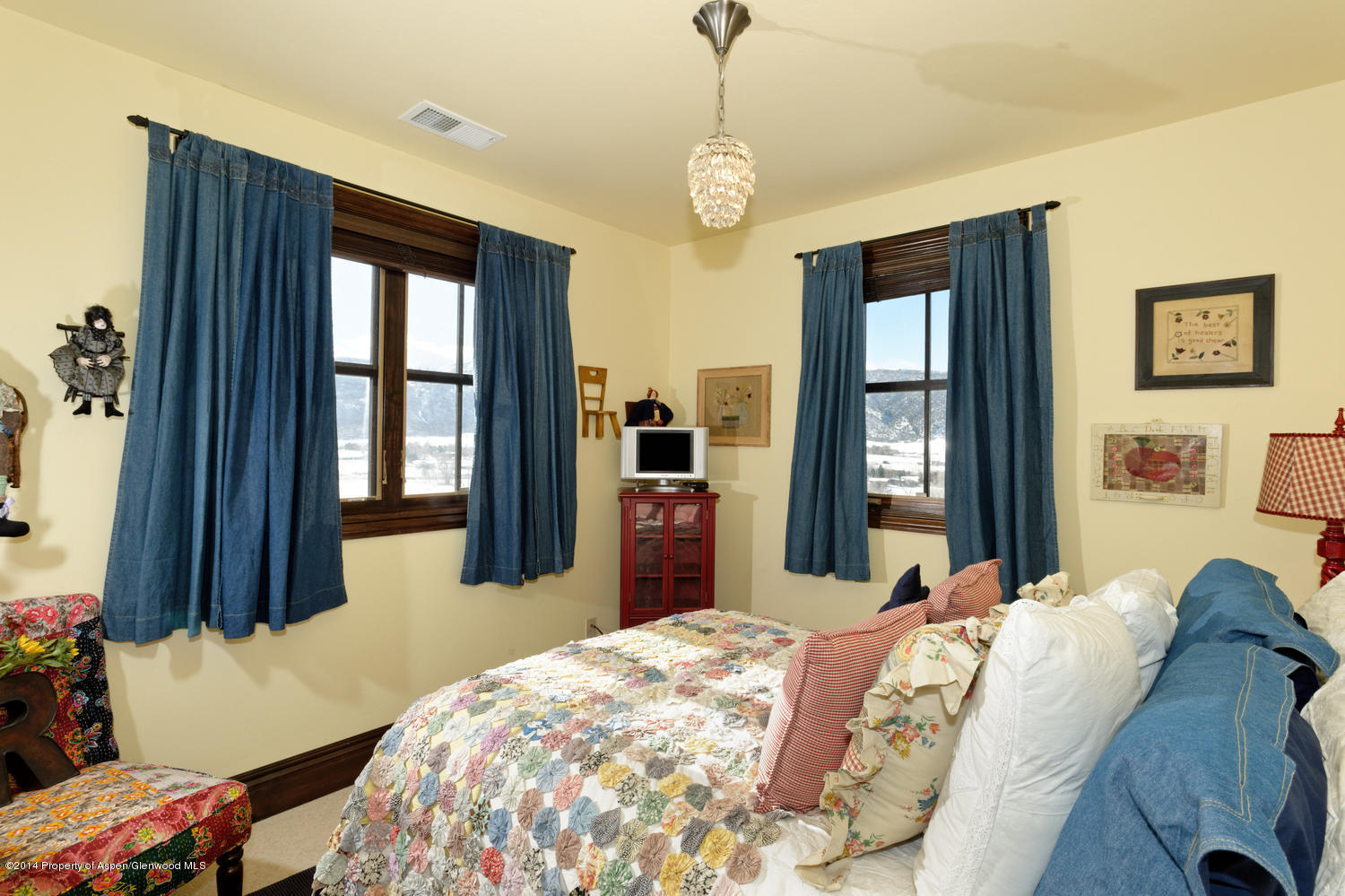 356 Hillcrest Drive Basalt, CO 81621 - Photo 11 of 29 a bedroom with a bed and wooden floor