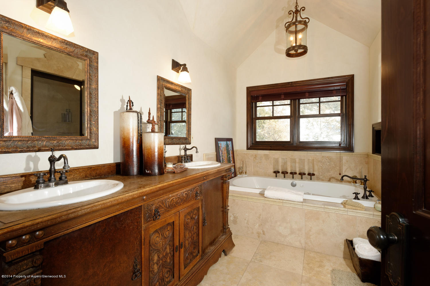 356 Hillcrest Drive Basalt, CO 81621 - Photo 14 of 29 a bathroom with a double vanity sink a mirror and a bathtub