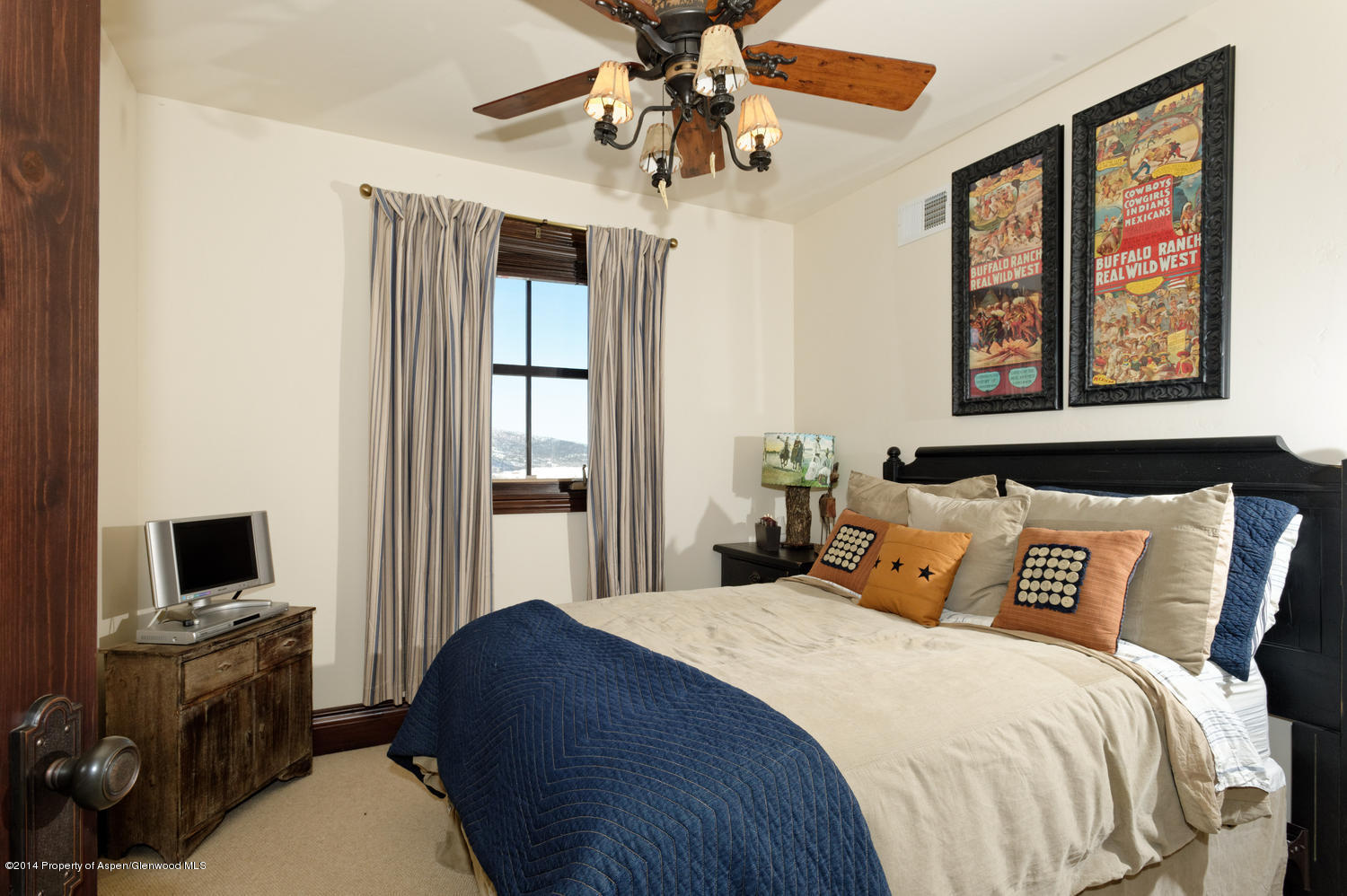 356 Hillcrest Drive Basalt, CO 81621 - Photo 18 of 29 a bedroom with a bed and a chandelier