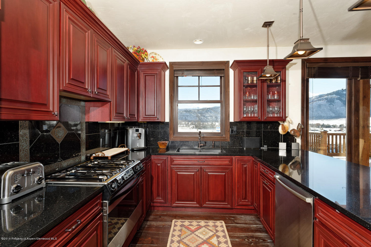 356 Hillcrest Drive Basalt, CO 81621 - Photo 7 of 29 a kitchen with a sink stove top oven and cabinets