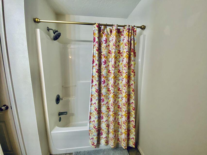 116 Dolphin Road Mary Esther, FL 32569 - Photo 13 of 13 a bathroom with a shower and a curtain