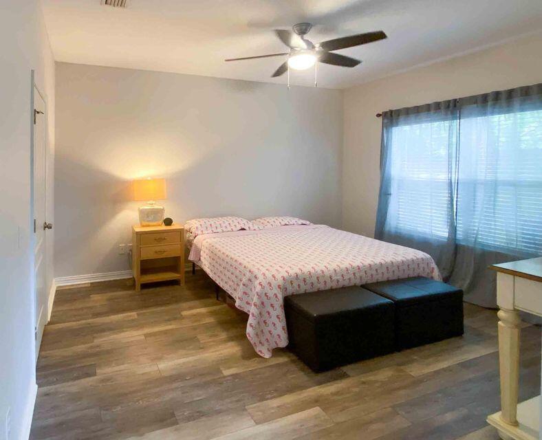 116 Dolphin Road Mary Esther, FL 32569 - Photo 8 of 13 a bed sitting in a spacious bedroom next to a window