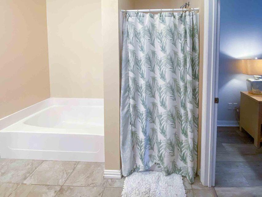 116 Dolphin Road Mary Esther, FL 32569 - Photo 10 of 13 a bathroom with a bathtub and shower