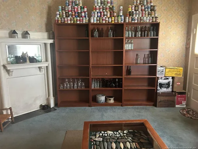 a kitchen with a refrigerator and cabinets