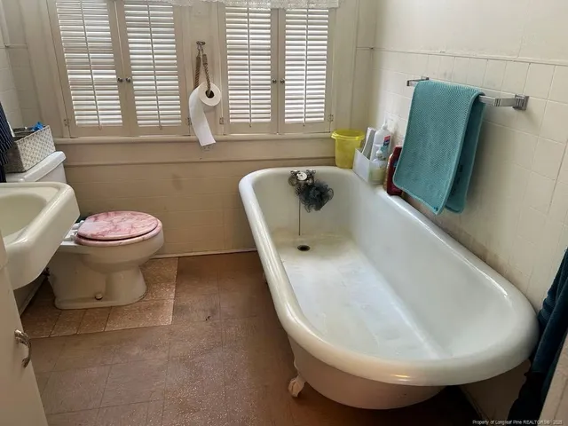 a bathroom with a sink and toilet