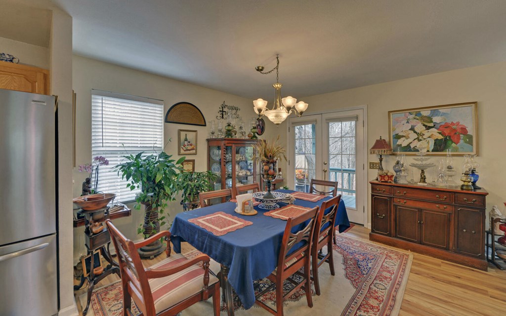 7300 Mr Bert Road Hiawassee, GA 30546 - Photo 11 of 48 a view of a dining room with furniture and window