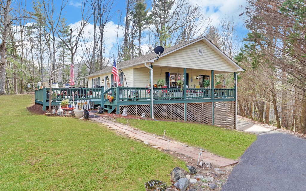 7300 Mr Bert Road Hiawassee, GA 30546 - Photo 2 of 48 a view of a house with a yard and sitting area