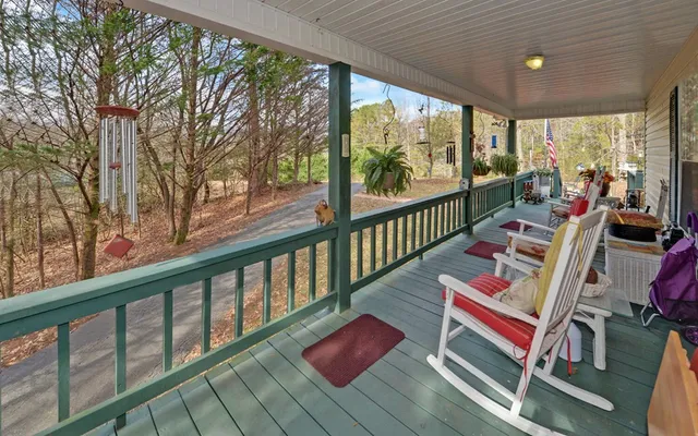 a view of city from balcony with furniture