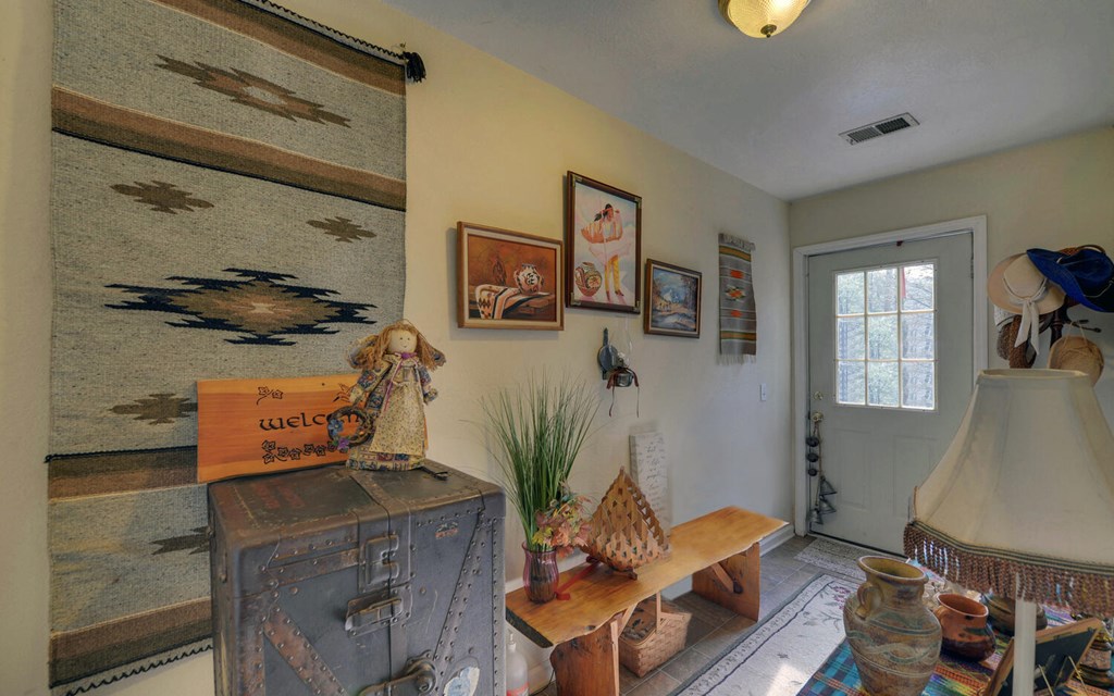 7300 Mr Bert Road Hiawassee, GA 30546 - Photo 27 of 48 a living room with furniture and a table