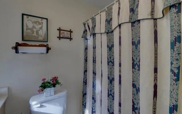 a view of a hallway with a flower pot