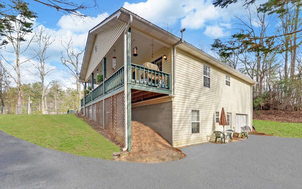 7300 Mr Bert Road Hiawassee, GA 30546 - Photo 38 of 48 a view of a house with a yard and pathway