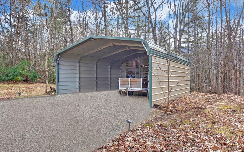 7300 Mr Bert Road Hiawassee, GA 30546 - Photo 48 of 48 a backyard of a house with barbeque oven and outdoor seating