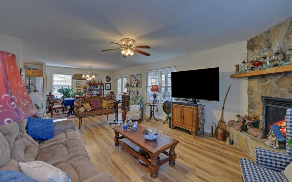 7300 Mr Bert Road Hiawassee, GA 30546 - Photo 7 of 48 a living room with furniture and a flat screen tv