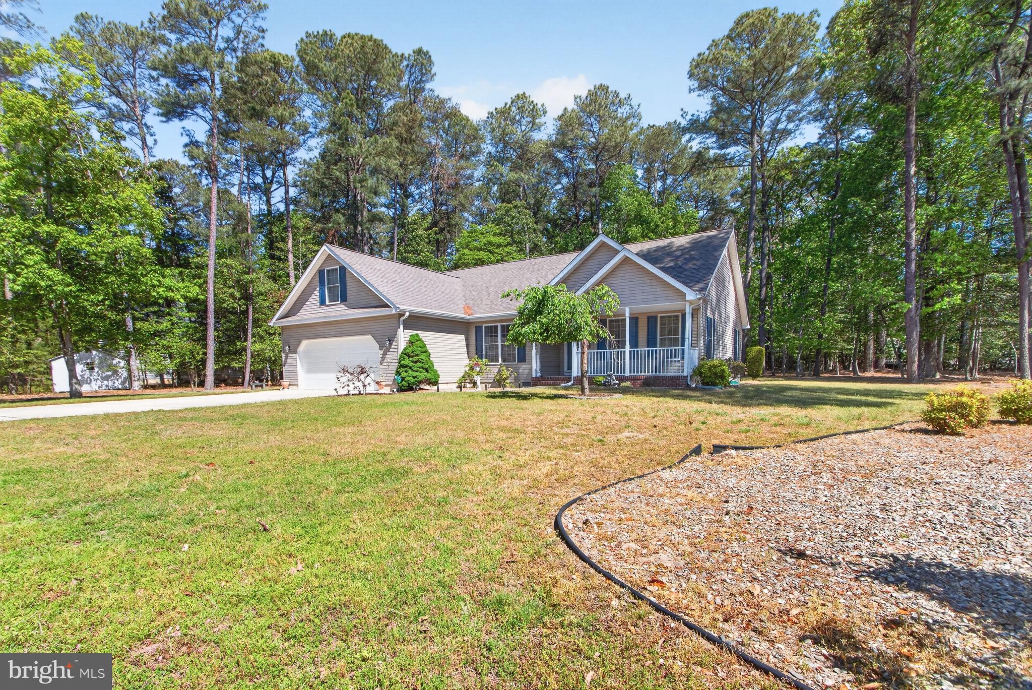 34371 Owls Nest Road Lewes, DE 19958 - Photo 1 of 58 a view of a house with swimming pool and a trees