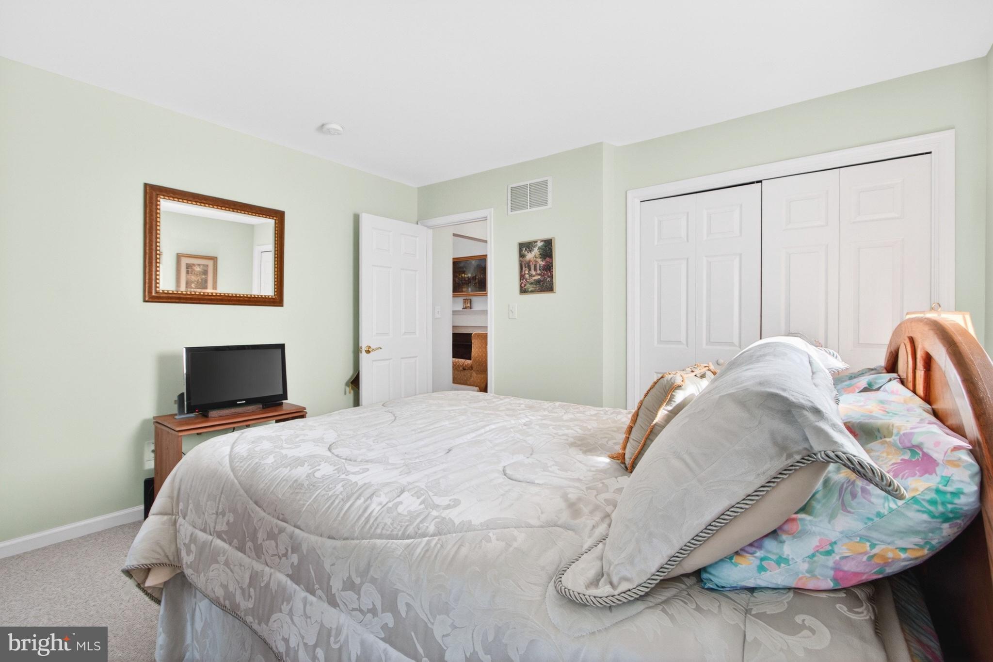 34371 Owls Nest Road Lewes, DE 19958 - Photo 32 of 58 a bedroom with a bed and a window