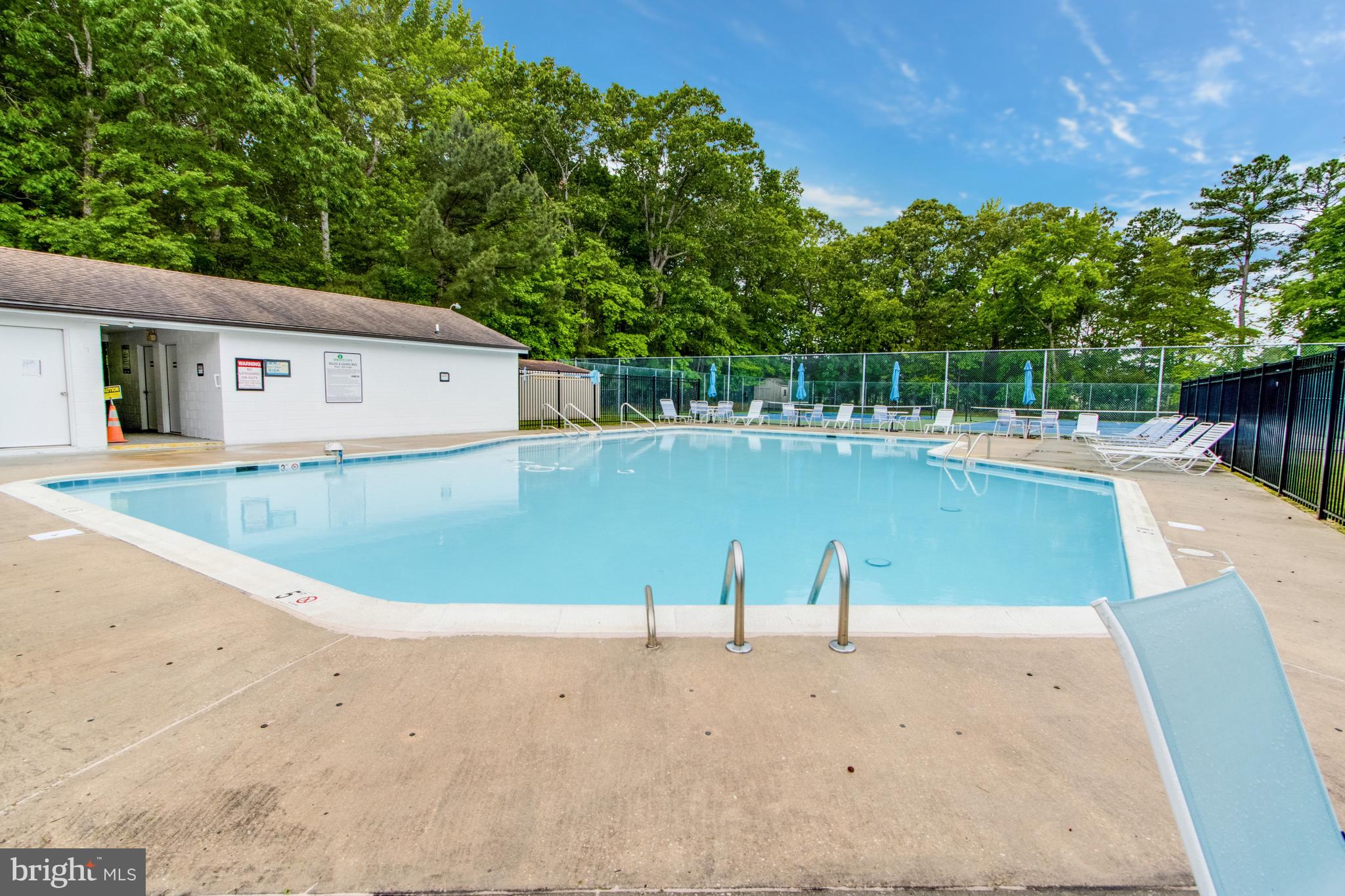 34371 Owls Nest Road Lewes, DE 19958 - Photo 57 of 58 a view of a swimming pool with a yard