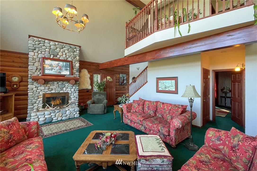 1006 Happy Valley Road Sequim, WA 98382 - Photo 11 of 40 a living room with furniture and a fireplace