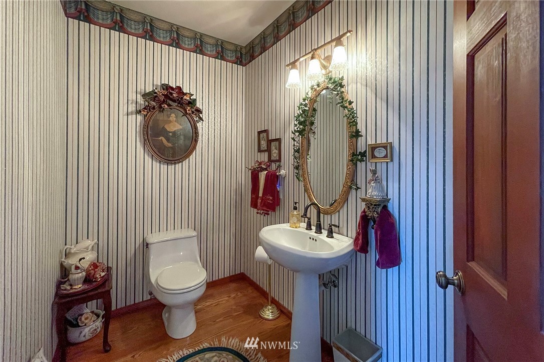 1006 Happy Valley Road Sequim, WA 98382 - Photo 20 of 40 a bathroom with a toilet sink and mirror