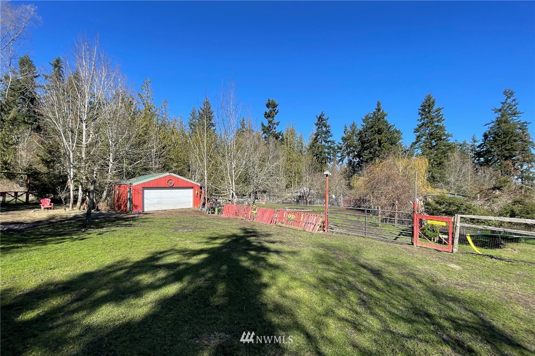 1006 Happy Valley Road Sequim, WA 98382 - Photo 38 of 40 a view of a house with a yard and sitting area