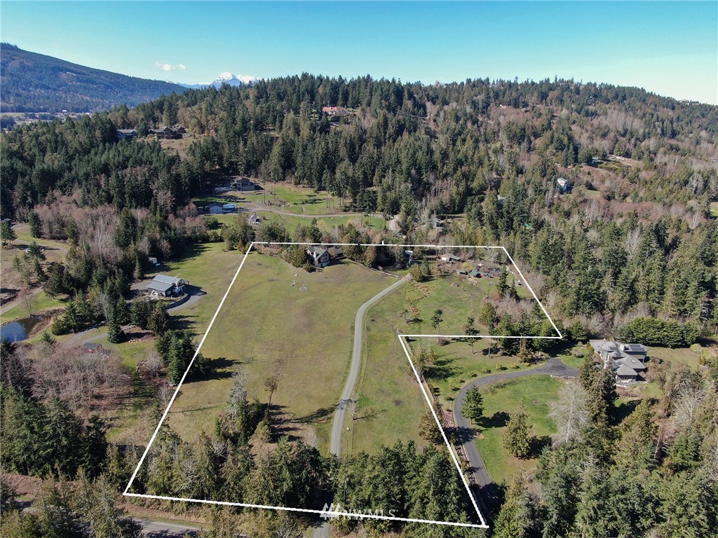 1006 Happy Valley Road Sequim, WA 98382 - Photo 5 of 40 an aerial view of a house with a yard