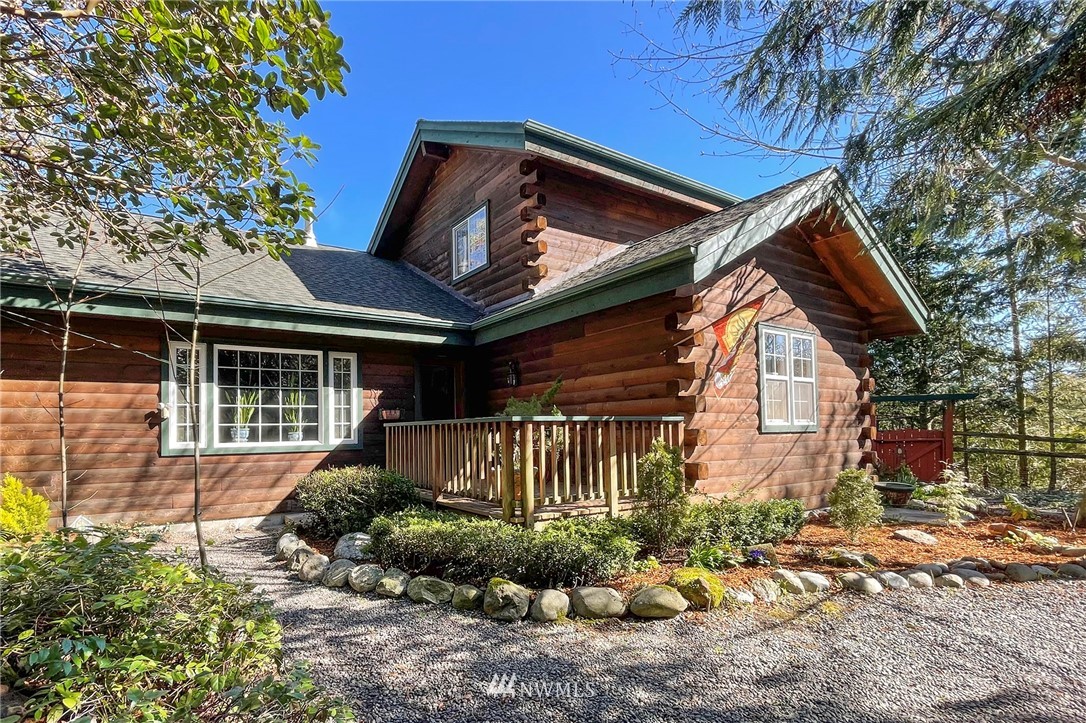 1006 Happy Valley Road Sequim, WA 98382 - Photo 7 of 40 a front view of a house with garden