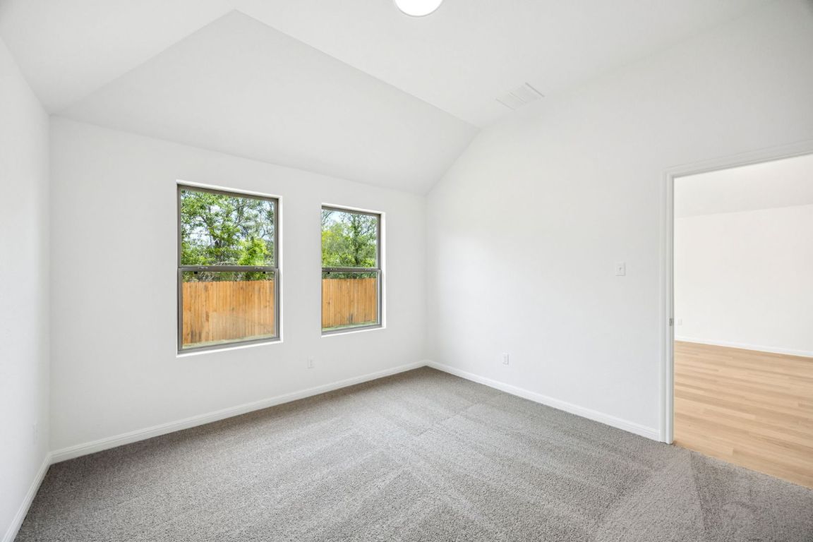 435 Lucky Avenue Elgin, TX 78621 - Photo 15 of 36 an empty room with windows