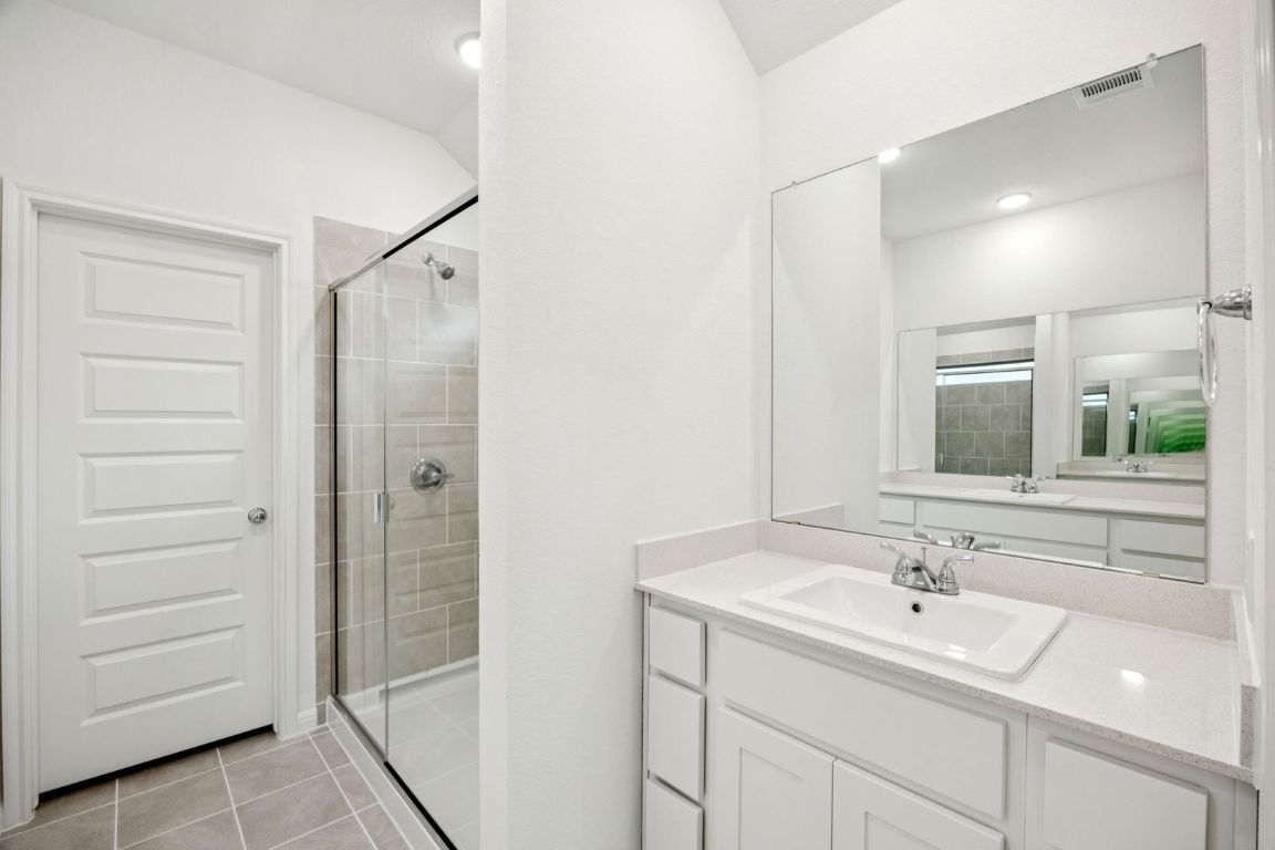 435 Lucky Avenue Elgin, TX 78621 - Photo 19 of 36 a bathroom with a sink and mirror