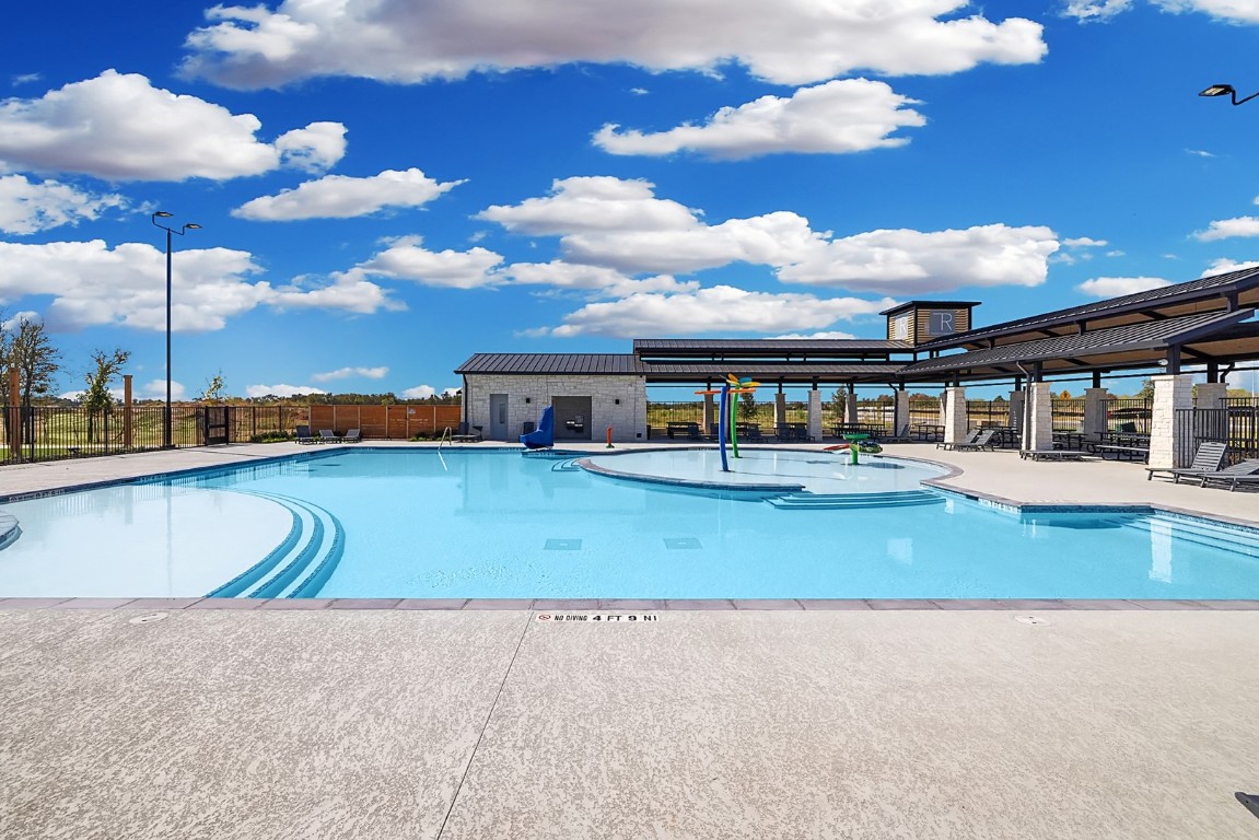 435 Lucky Avenue Elgin, TX 78621 - Photo 28 of 36 a view of a swimming pool with a patio