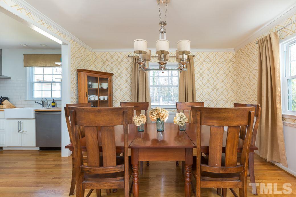 7404 Fiesta Way Raleigh, NC 27615 - Photo 4 of 11 a view of a dining room with furniture window and wooden floor