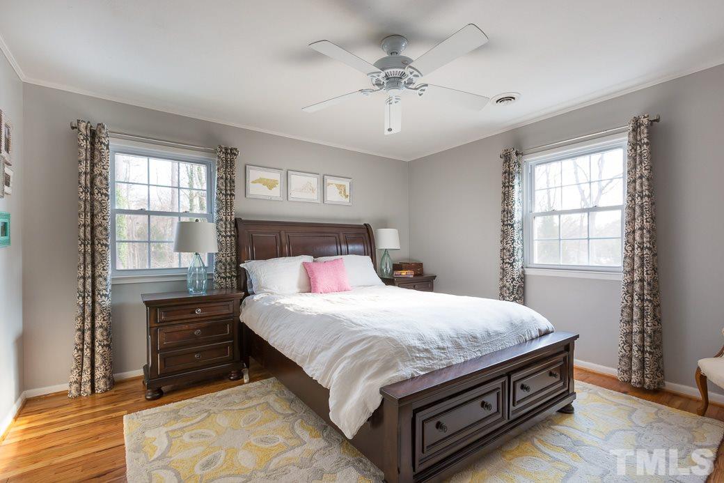 7404 Fiesta Way Raleigh, NC 27615 - Photo 7 of 11 a bedroom with a bed and a window