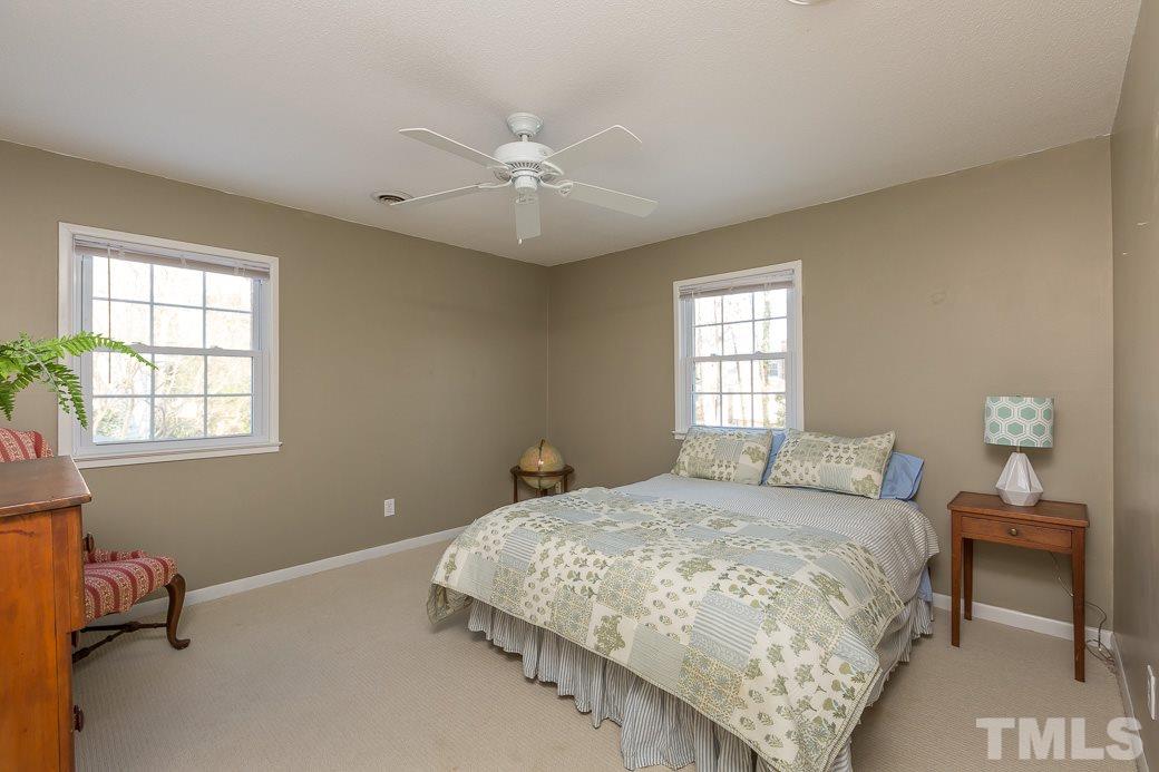 7404 Fiesta Way Raleigh, NC 27615 - Photo 9 of 11 a bedroom with a bed and a window