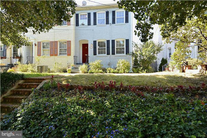 1208 Portner Road Alexandria, VA 22314 - Photo 1 of 30 a front view of a house with a yard