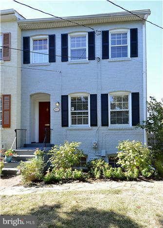1208 Portner Road Alexandria, VA 22314 - Photo 2 of 30 a front view of a house with a yard and outdoor seating
