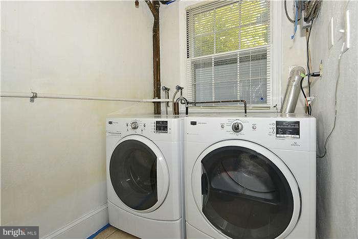 1208 Portner Road Alexandria, VA 22314 - Photo 21 of 30 a view of a storage & utility room with dryer and washer