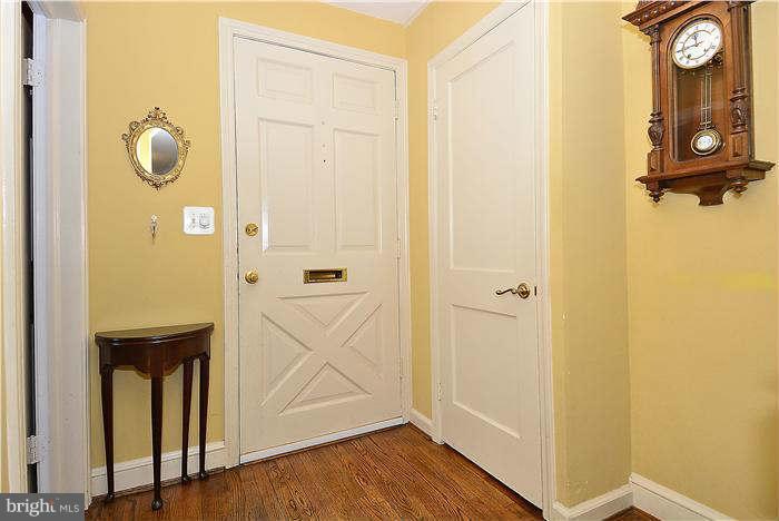 1208 Portner Road Alexandria, VA 22314 - Photo 4 of 30 a view of a hallway with wooden floor