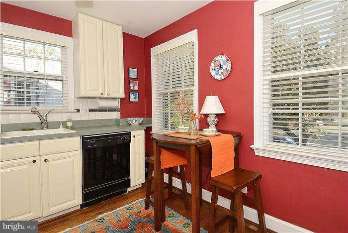1208 Portner Road Alexandria, VA 22314 - Photo 5 of 30 a kitchen with a table chairs and a window